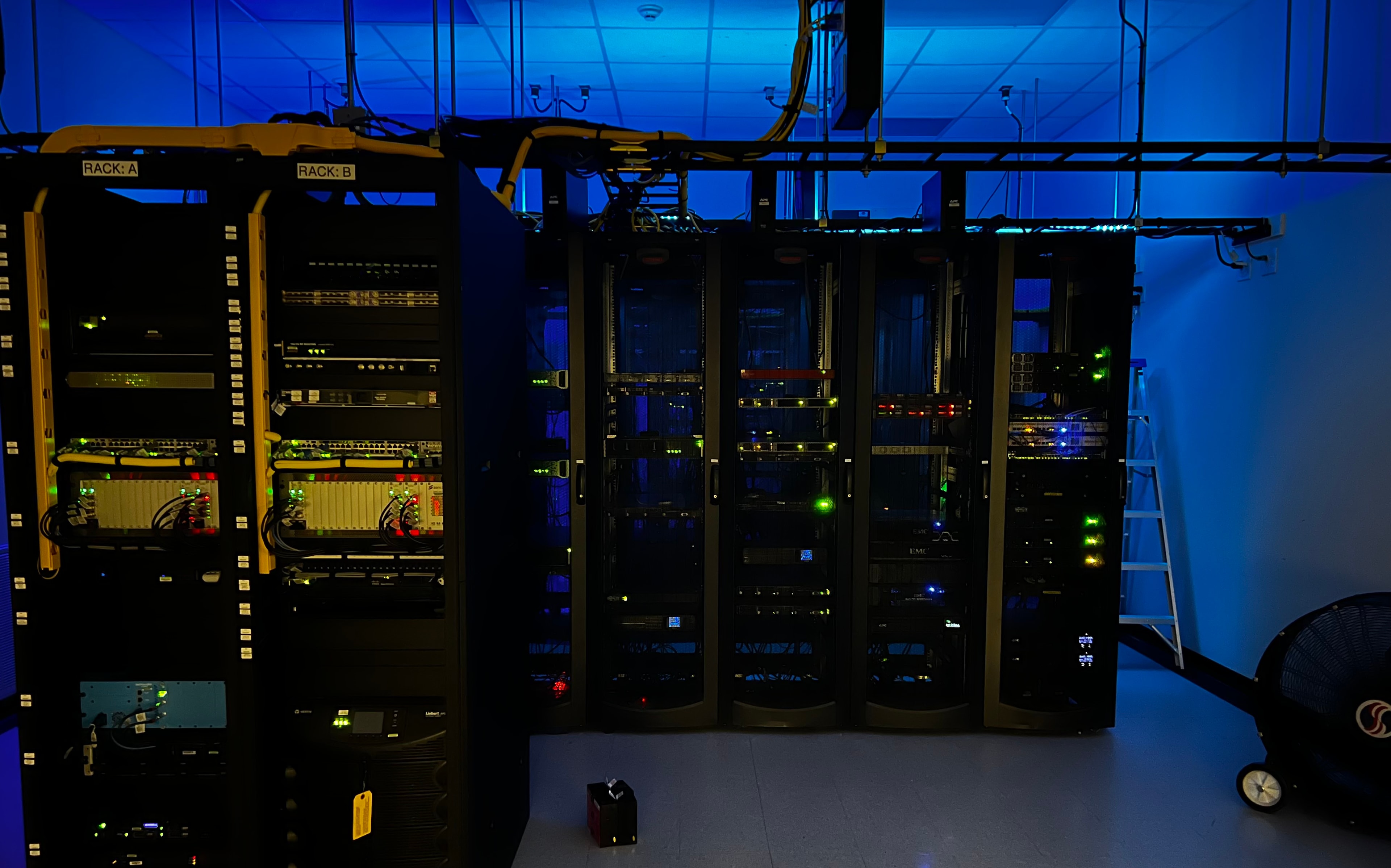 CyberSharks server racks with indicator lights glowing